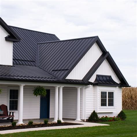 white house with black metal roof|houses with white metal roofs.